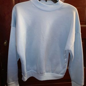 pastel blue sweater